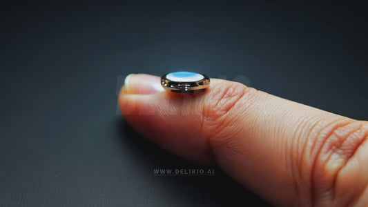 A tiny wearable device, like a button on a finger, generating holograms and showcasing miniature AI technology.