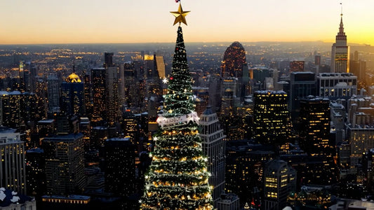 A stunning city sunset scene where the Christmas tree is lit up, casting a warm glow over the cityscape and creating a festive atmosphere.