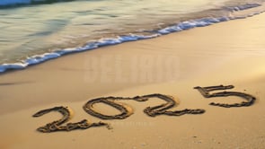 """2025"" written in beach sand with gentle waves rolling over, creating a serene, natural New Year greeting."