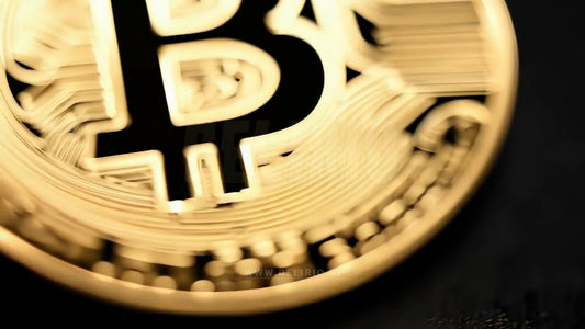 Gold crypto coin spinning with bullish bulls in the background, illustrating the optimism in Bitcoin�s market and investment value.