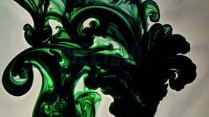 Green and black dramatic ink splatter design showcasing dynamic color explosions.