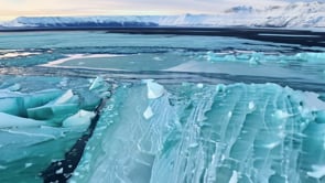 Aerial view of a glacier melting, rising water levels, environmental issue, highlighting the effects of climate change, global warming, and the loss of polar ice.