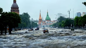 Floodwaters taking over a Russian city, streets causing evacuation, illustrating the emergency response and damage from catastrophic flooding.