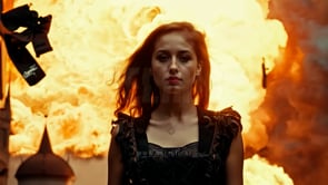 A cyberpunk-inspired cinematic escape scene of a woman walking away from an explosion, emphasizing tension and intensity.