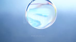 Macro image of water bubbles against a clear blue sky, highlighting transparency in skincare product design.