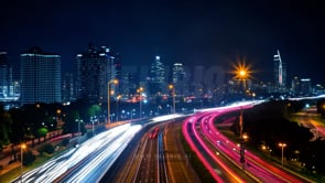 Nighttime cityscapes captured in wide-angle time-lapse, showing traffic flow illuminated by dynamic lights.