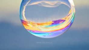 Close-up shot of a bubble with a lotion-like texture, emphasizing skincare and healthcare in a macro aesthetic.